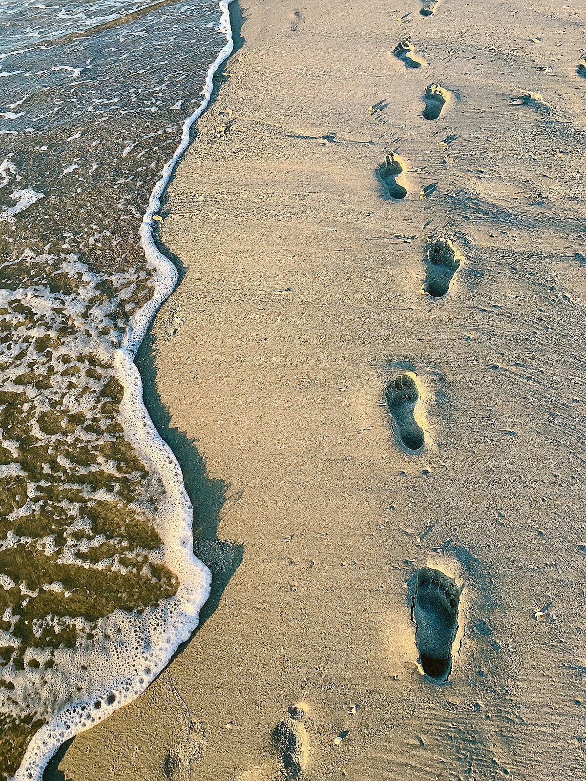 Fußstapfen im Sand